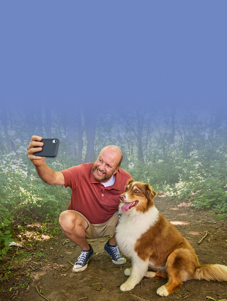 John, a hypertrophic cardiomyopathy (HCM) patient, taking a selfie with his dog